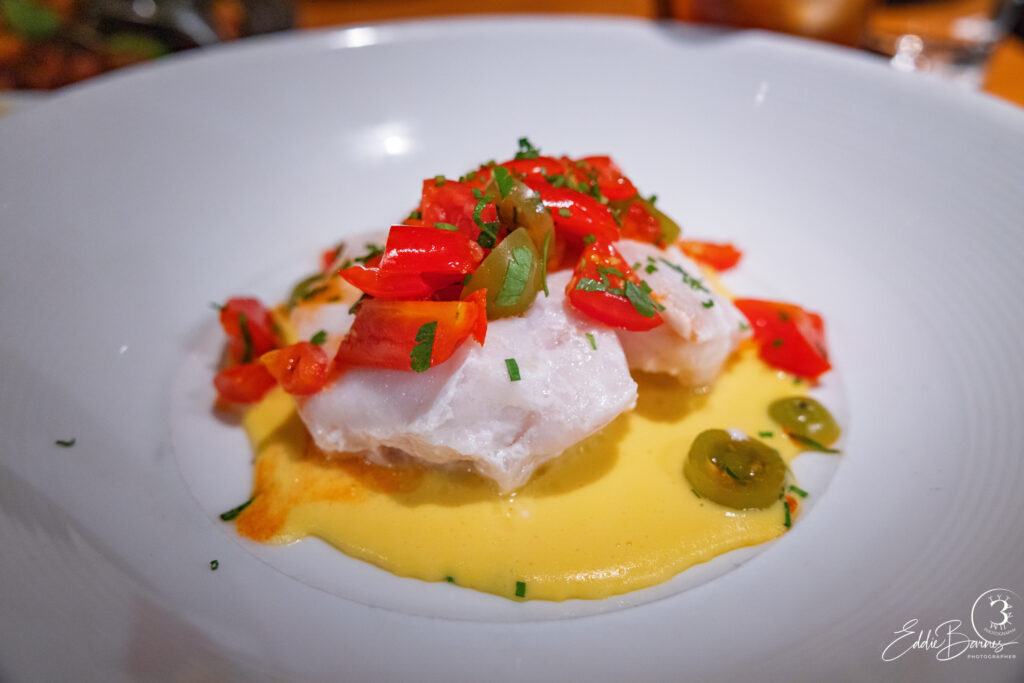 Butter poached grouper with corn purée and heirloom tomato salad, styled plate highlighted through luxury food photography Charleston SC.
